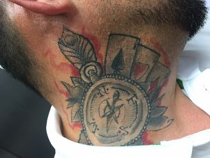 neck tattoo with playing card symbols